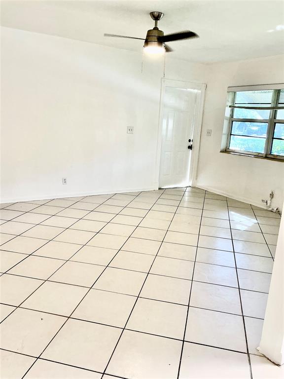 1645 Northeast 12th Street, Unit B Fort Lauderdale, FL 33304 - Photo 11 of 20 a view of an empty room and window