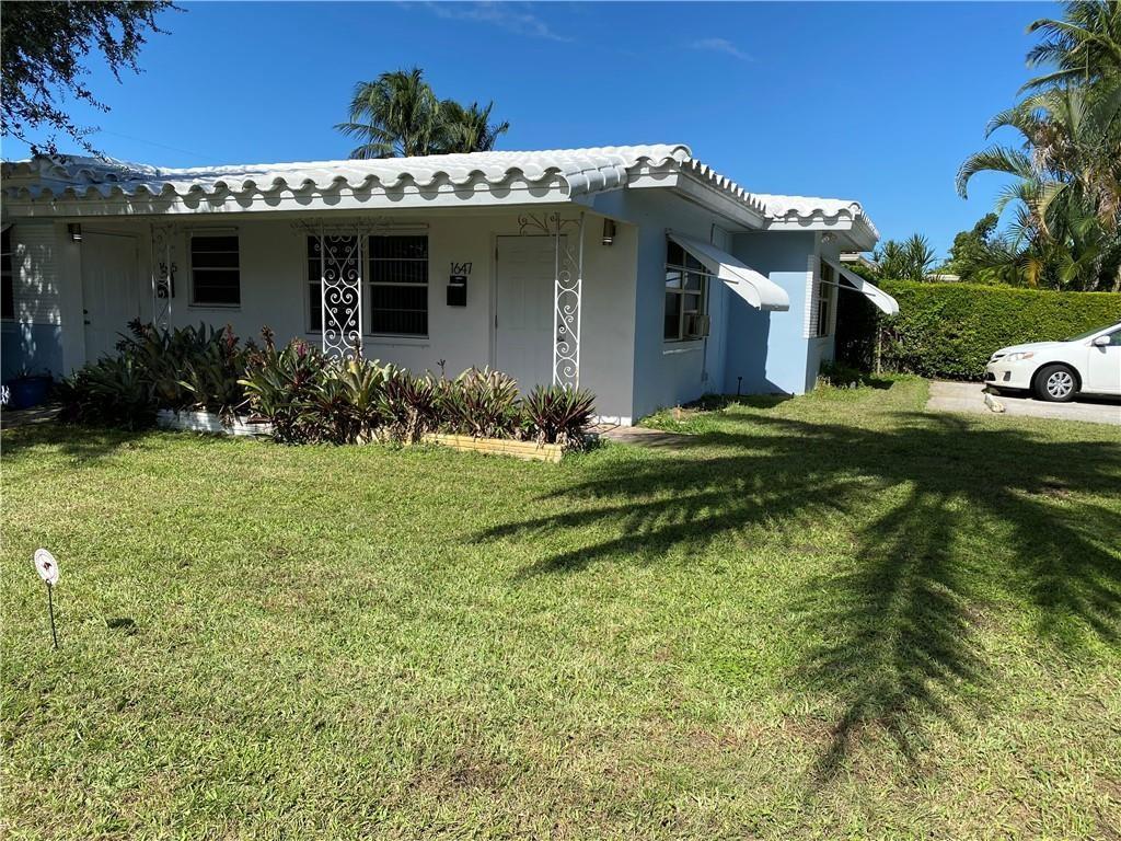 1645 Northeast 12th Street, Unit B Fort Lauderdale, FL 33304 - Photo 20 of 20 a view of a house with a yard