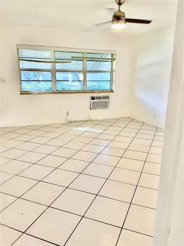 a view of a livingroom and window