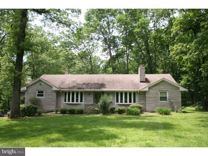 62 Pin Oak Road Skillman, NJ 08558 - Photo 1 of 21 a front view of a house with a garden