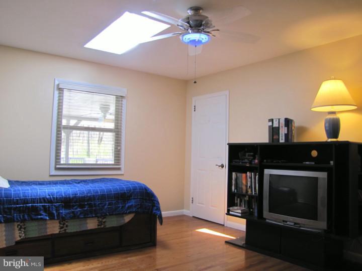 62 Pin Oak Road Skillman, NJ 08558 - Photo 11 of 21 a bedroom with a bed and a fireplace