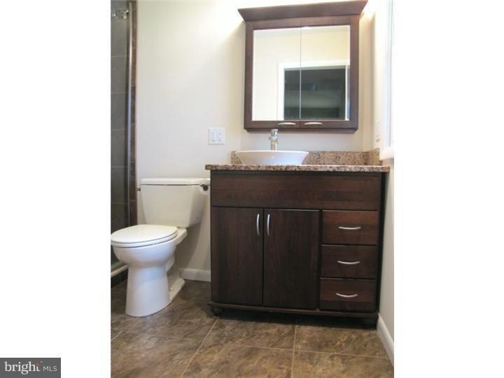 62 Pin Oak Road Skillman, NJ 08558 - Photo 12 of 21 a bathroom with a toilet sink and mirror