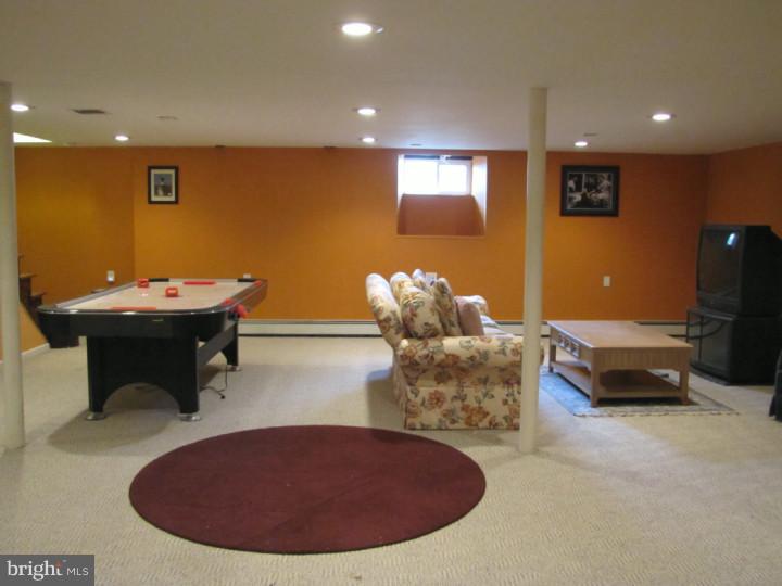 62 Pin Oak Road Skillman, NJ 08558 - Photo 20 of 21 a room with furniture and air hockey table