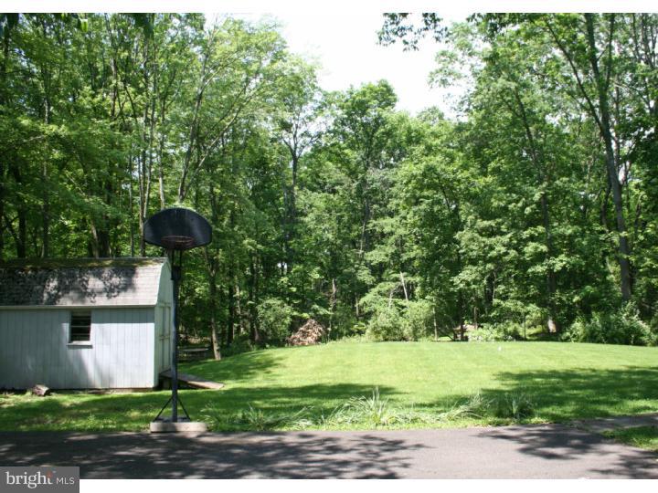 62 Pin Oak Road Skillman, NJ 08558 - Photo 21 of 21 a front view of a house with garden