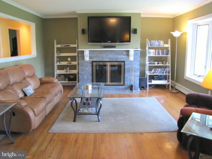 62 Pin Oak Road Skillman, NJ 08558 - Photo 3 of 21 a living room with furniture and a flat screen tv