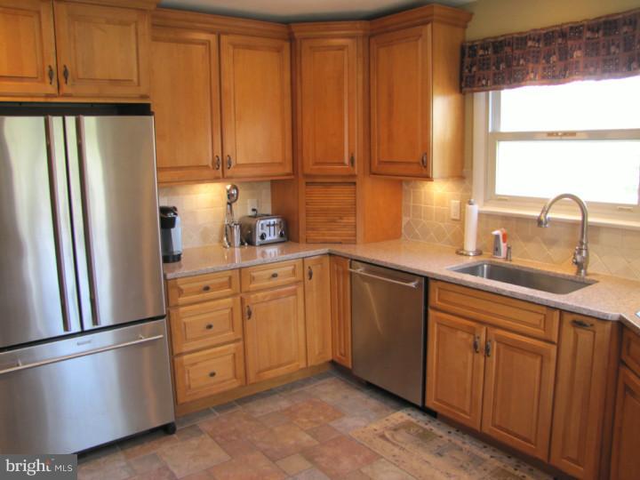 62 Pin Oak Road Skillman, NJ 08558 - Photo 8 of 21 a kitchen with stainless steel appliances a refrigerator sink and cabinets