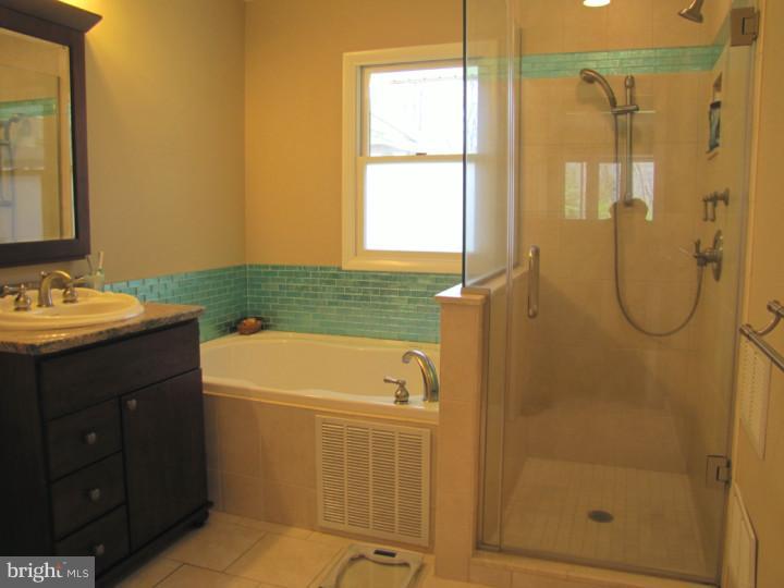 62 Pin Oak Road Skillman, NJ 08558 - Photo 10 of 21 a bathroom with a tub a sink and a shower