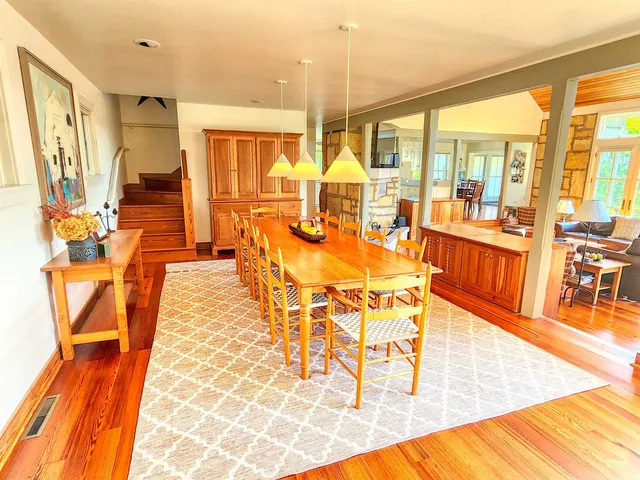 a living room with fireplace furniture and a flat screen tv