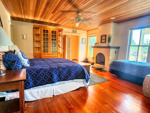 a bathroom with a toilet a sink and a window