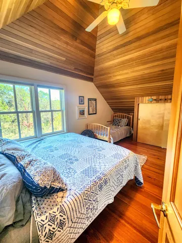 a view of a lake with houses in the back