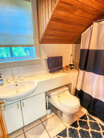 a view of a swimming pool with a yard and sitting area