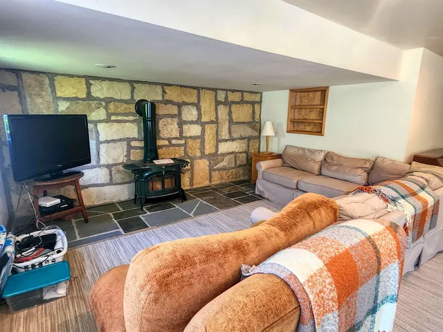 a view of a house with a yard and sitting area