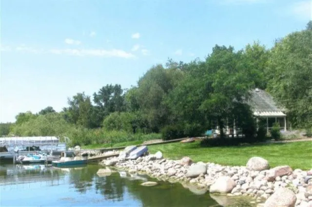 a view of a lake with a house in the background