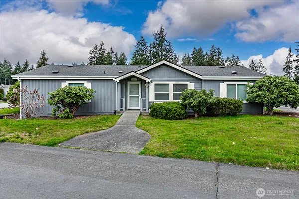 front view of a house with a yard