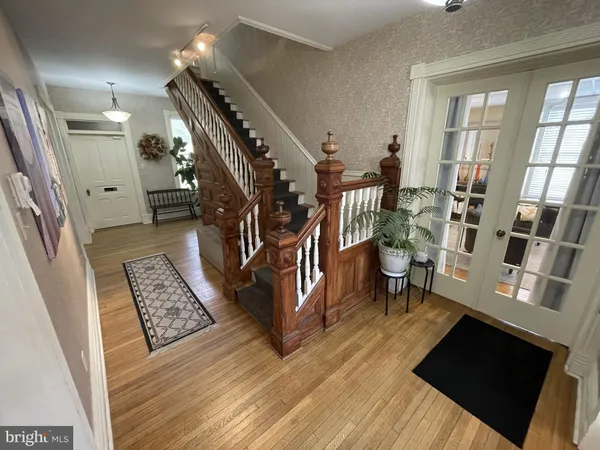 a view of an entryway with wooden floor