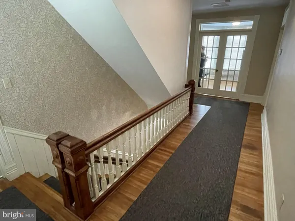 a view of a hallway with staircase