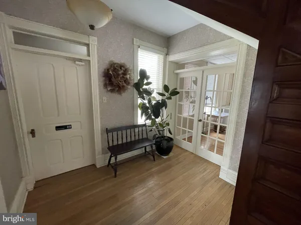 a view of entryway with wooden floor and stairs