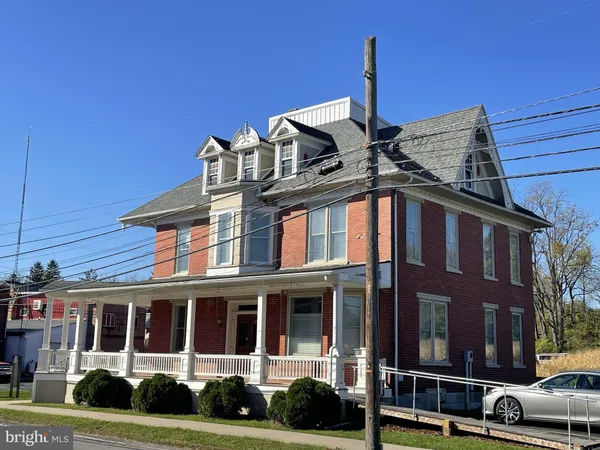 a front view of a building with street view