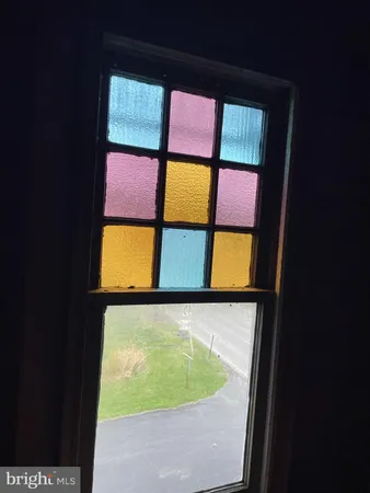 a view of an brick wall with a window