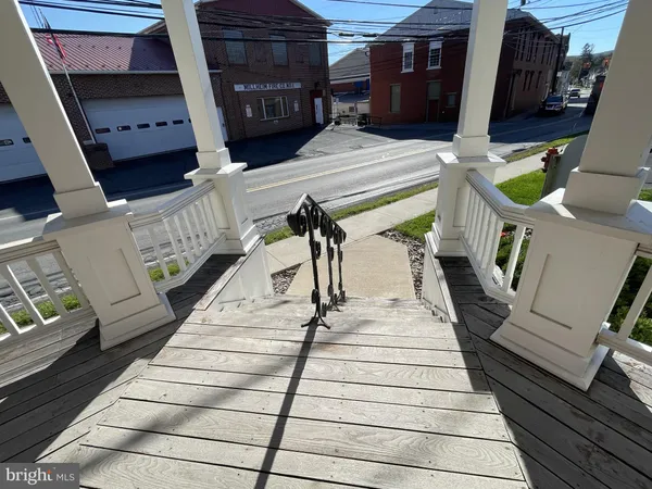 a view of a balcony with car parked