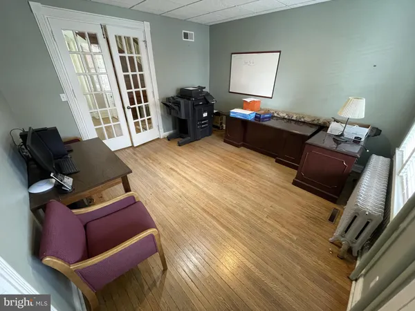 a bedroom with furniture and a window