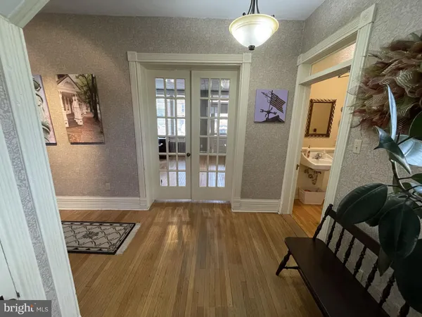 a view of a living room and hardwood floor
