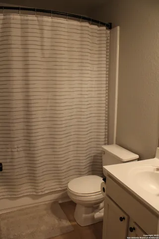 a bathroom with a toilet and a sink