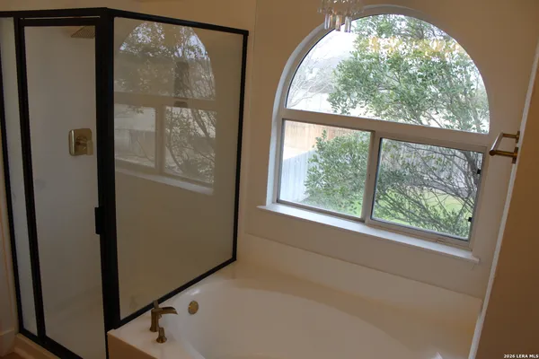 a view of empty room with large windows