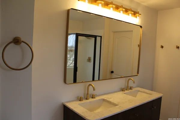 a bathroom with a sink and a mirror
