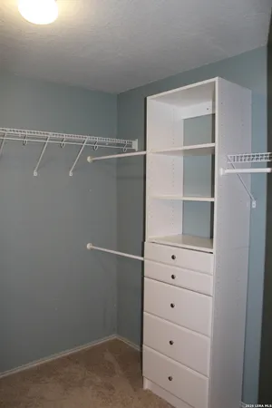 a view of an empty walk in closet