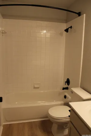 a close view of closet with racks on the wall