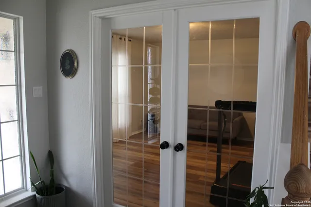 a bathroom with a glass shower door