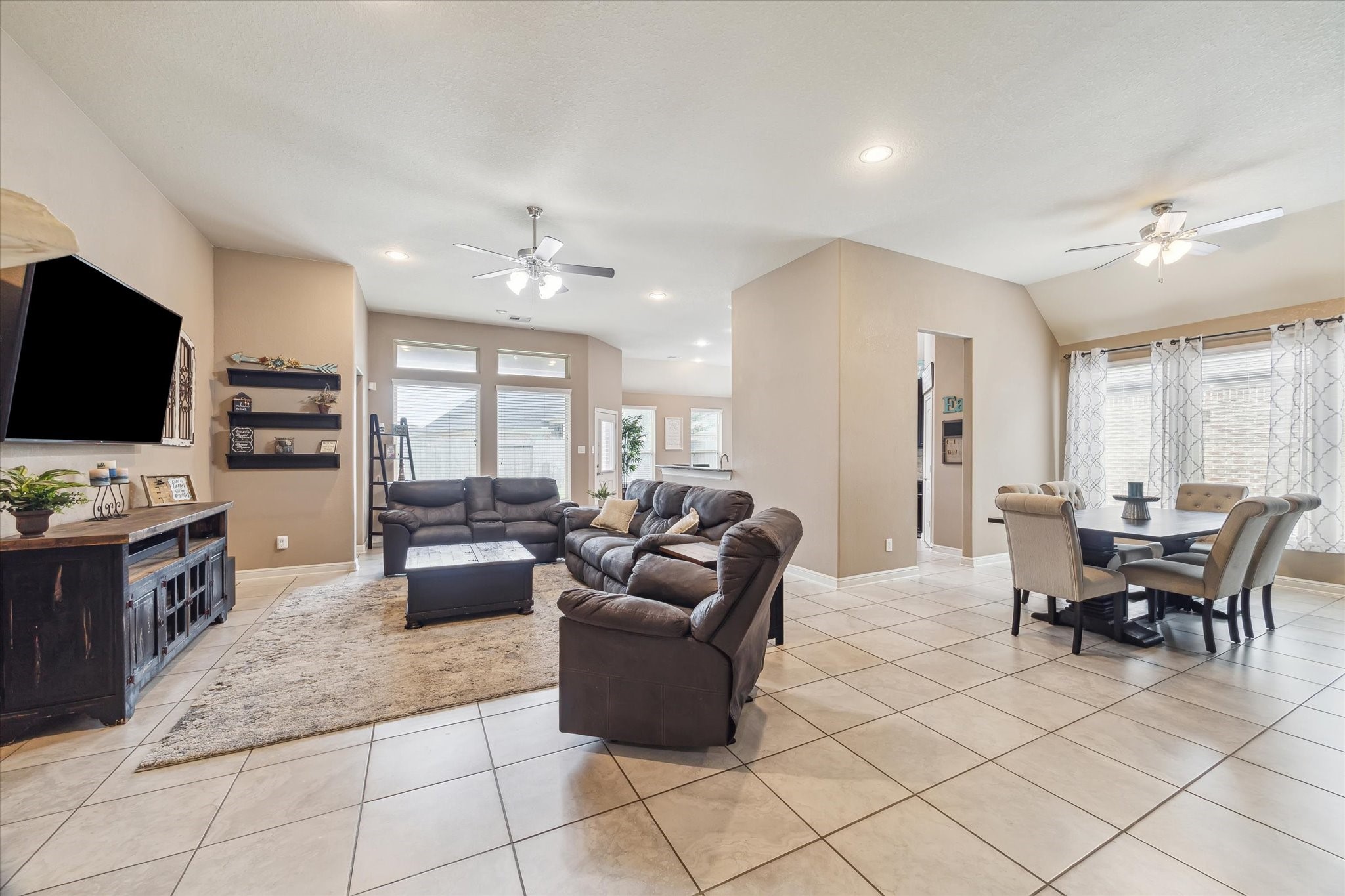 4914 Mountain Maple Trail Rosenberg, TX 77471 - Photo 5 of 24 Expansive open-concept layout seamlessly connecting the living room, dining area, and kitchen perfect for everyday living and effortless entertaining.