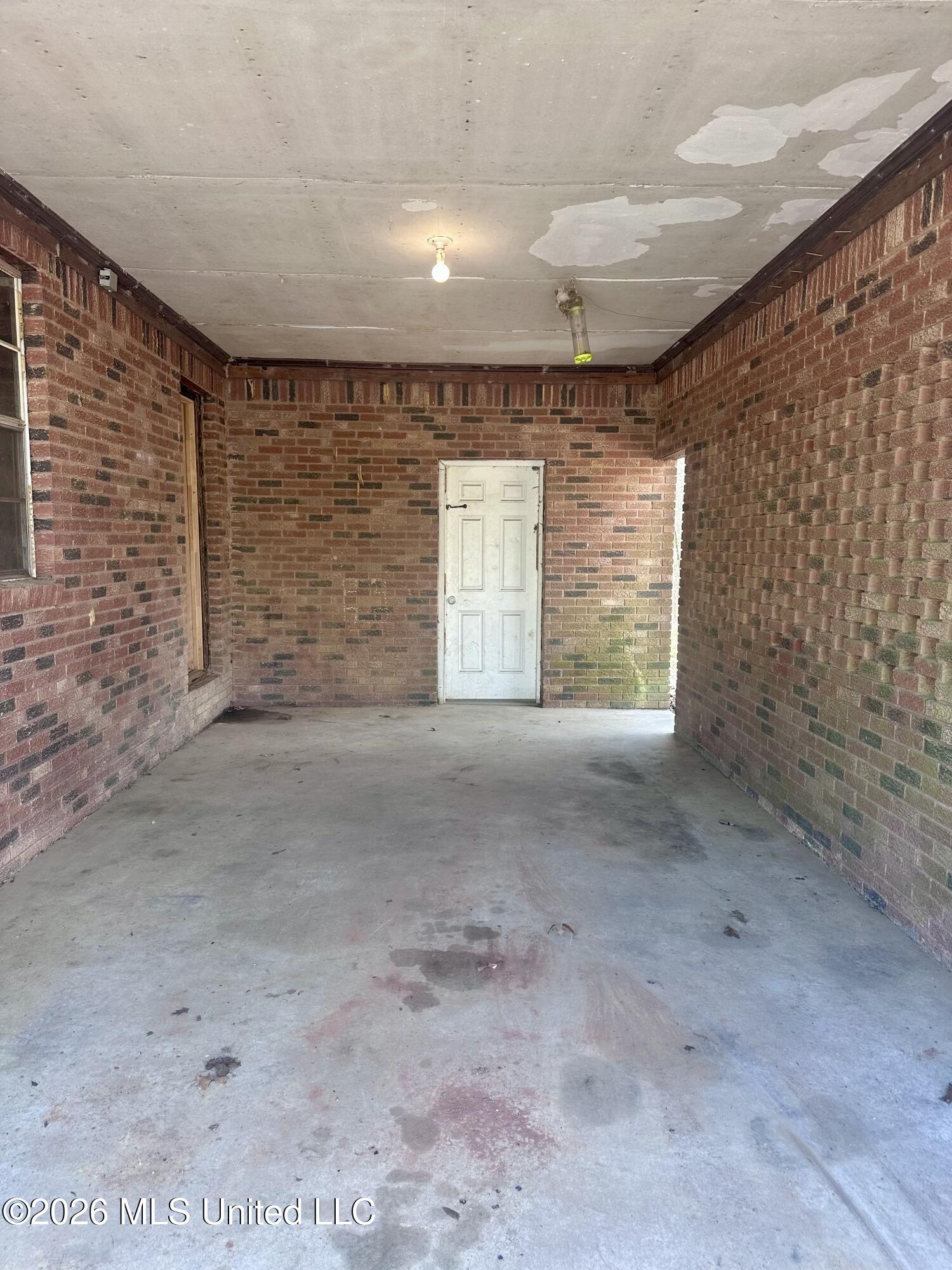 10591 Woolsey Road Olive Branch, MS 38654 - Photo 6 of 24 Carport with storage room