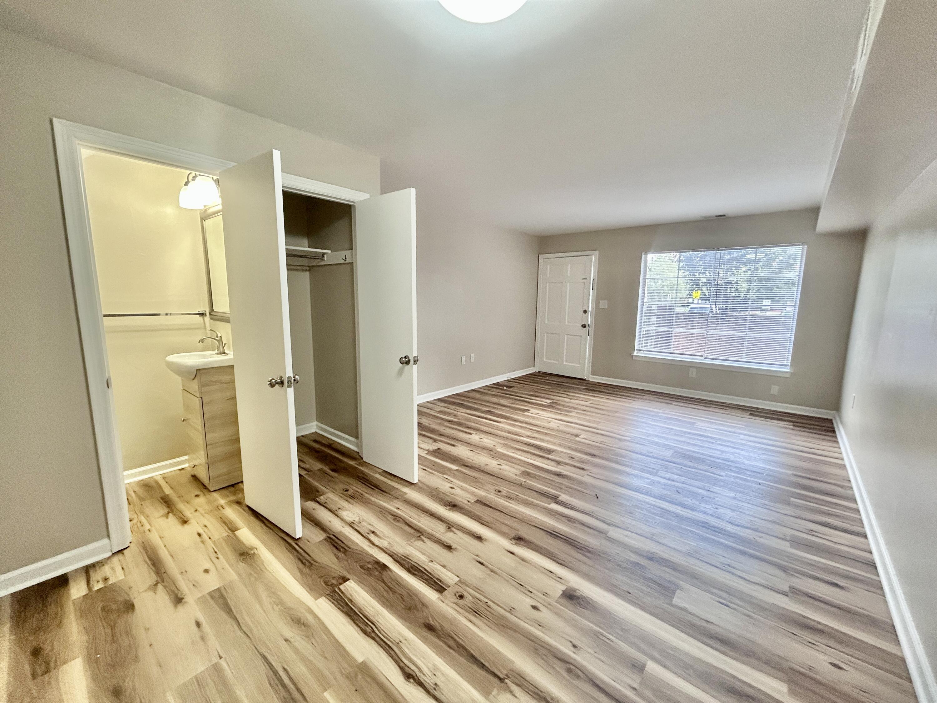 1803 Grandin Road Southwest Roanoke, VA 24015 - Photo 10 of 33 wooden floor in an empty room with a fireplace