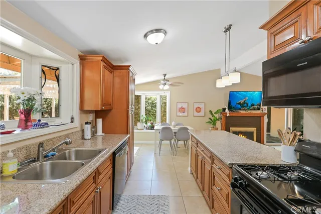 a kitchen with sink stove and cabinets