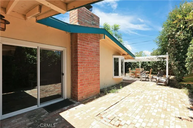 a view of swimming pool with patio