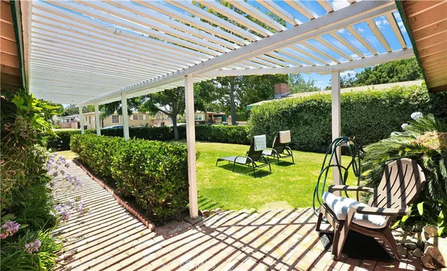 a view of a chair and table on the patio