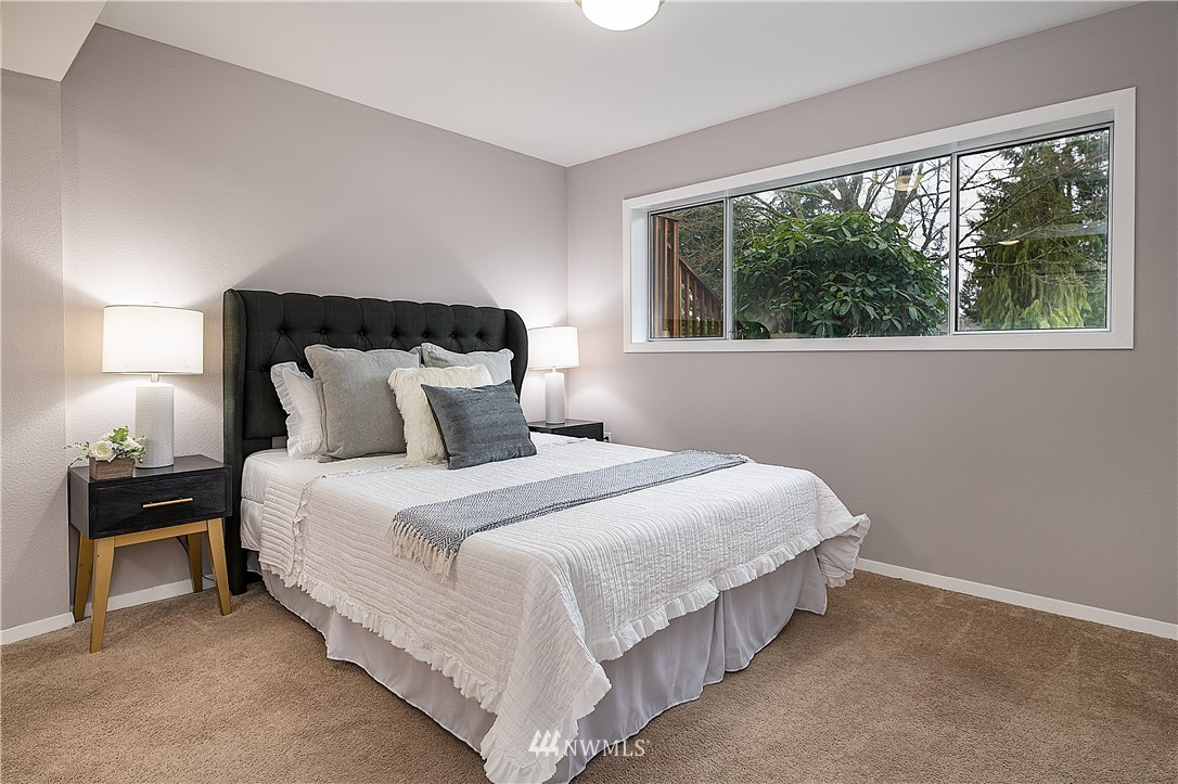 21723 2nd Avenue Southeast Bothell, WA 98021 - Photo 15 of 27 a bedroom with a bed and a lamp with window