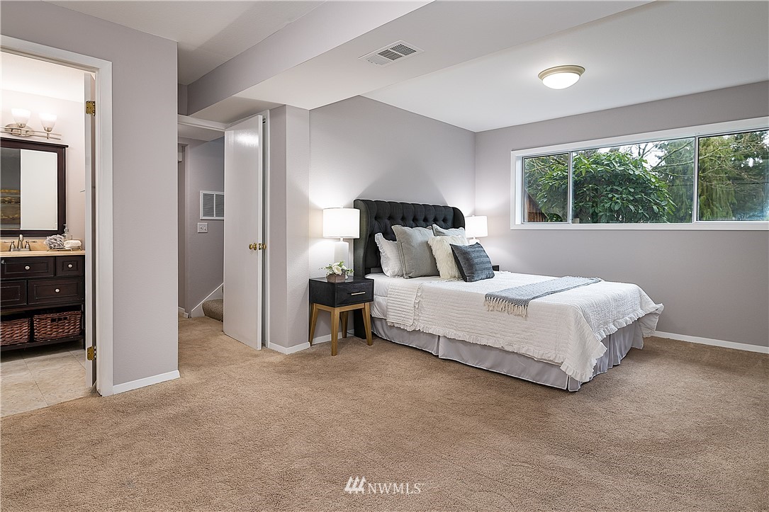 21723 2nd Avenue Southeast Bothell, WA 98021 - Photo 16 of 27 a bedroom with a bed and a large window
