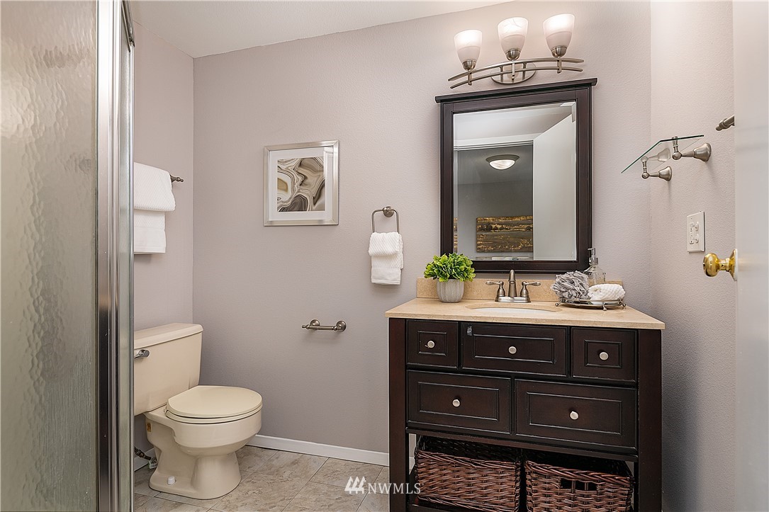 21723 2nd Avenue Southeast Bothell, WA 98021 - Photo 17 of 27 a bathroom with a toilet a sink and mirror