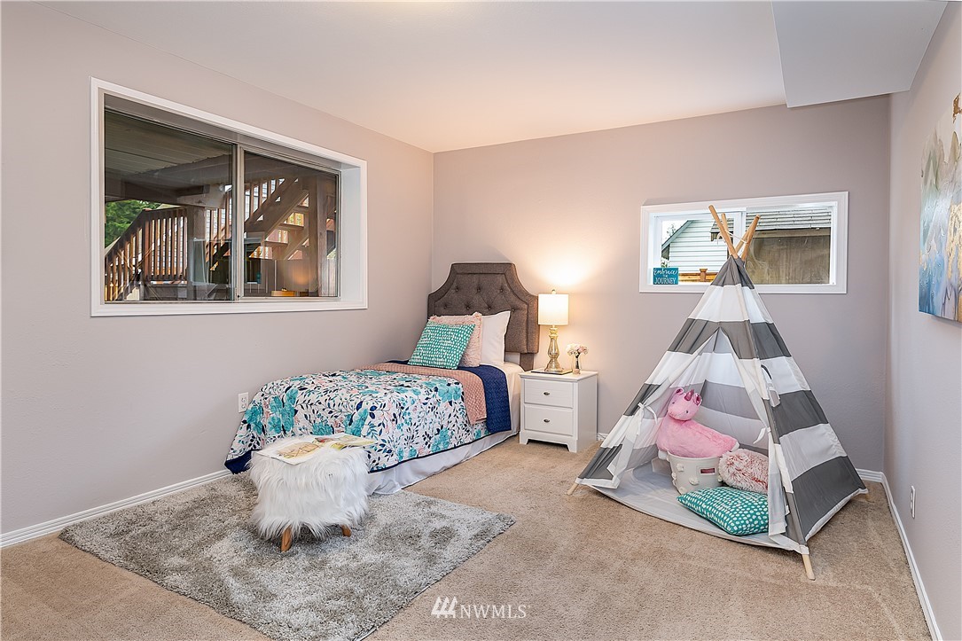 21723 2nd Avenue Southeast Bothell, WA 98021 - Photo 18 of 27 a bedroom with a bed and window