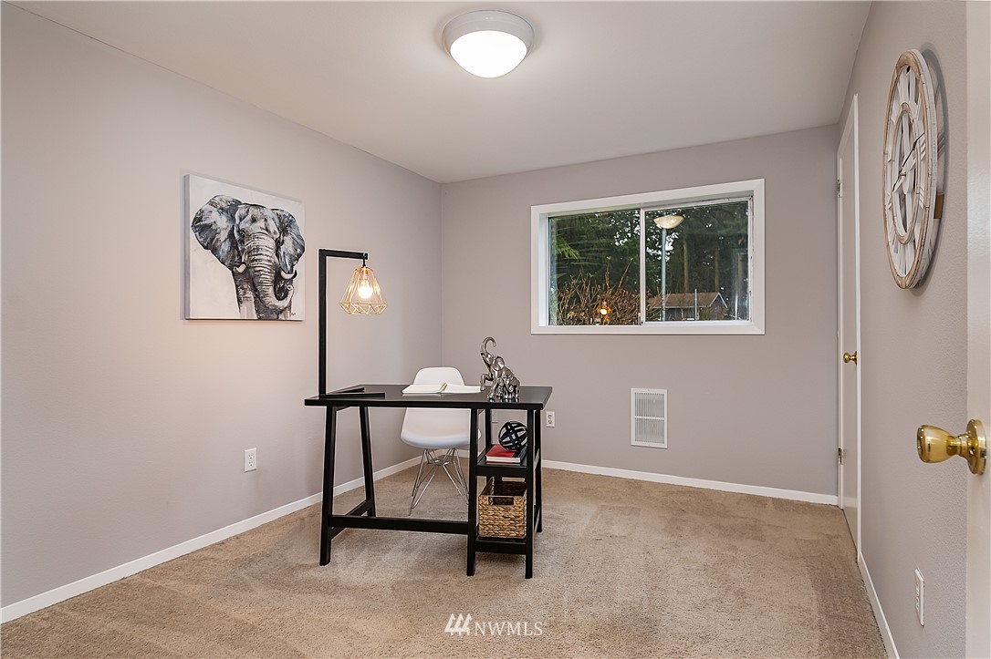 21723 2nd Avenue Southeast Bothell, WA 98021 - Photo 19 of 27 a view of a workspace with furniture and a window