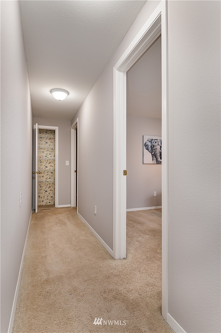 21723 2nd Avenue Southeast Bothell, WA 98021 - Photo 22 of 27 an empty room with closet and a bathroom