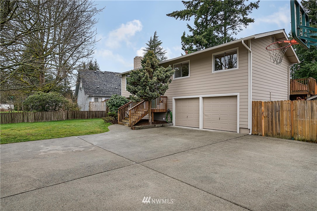 21723 2nd Avenue Southeast Bothell, WA 98021 - Photo 27 of 27 a view of a house with a yard and garage