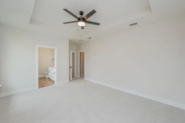 a bathroom with a double vanity sink toilet and mirror