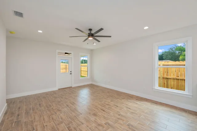 a view of an empty room with a window