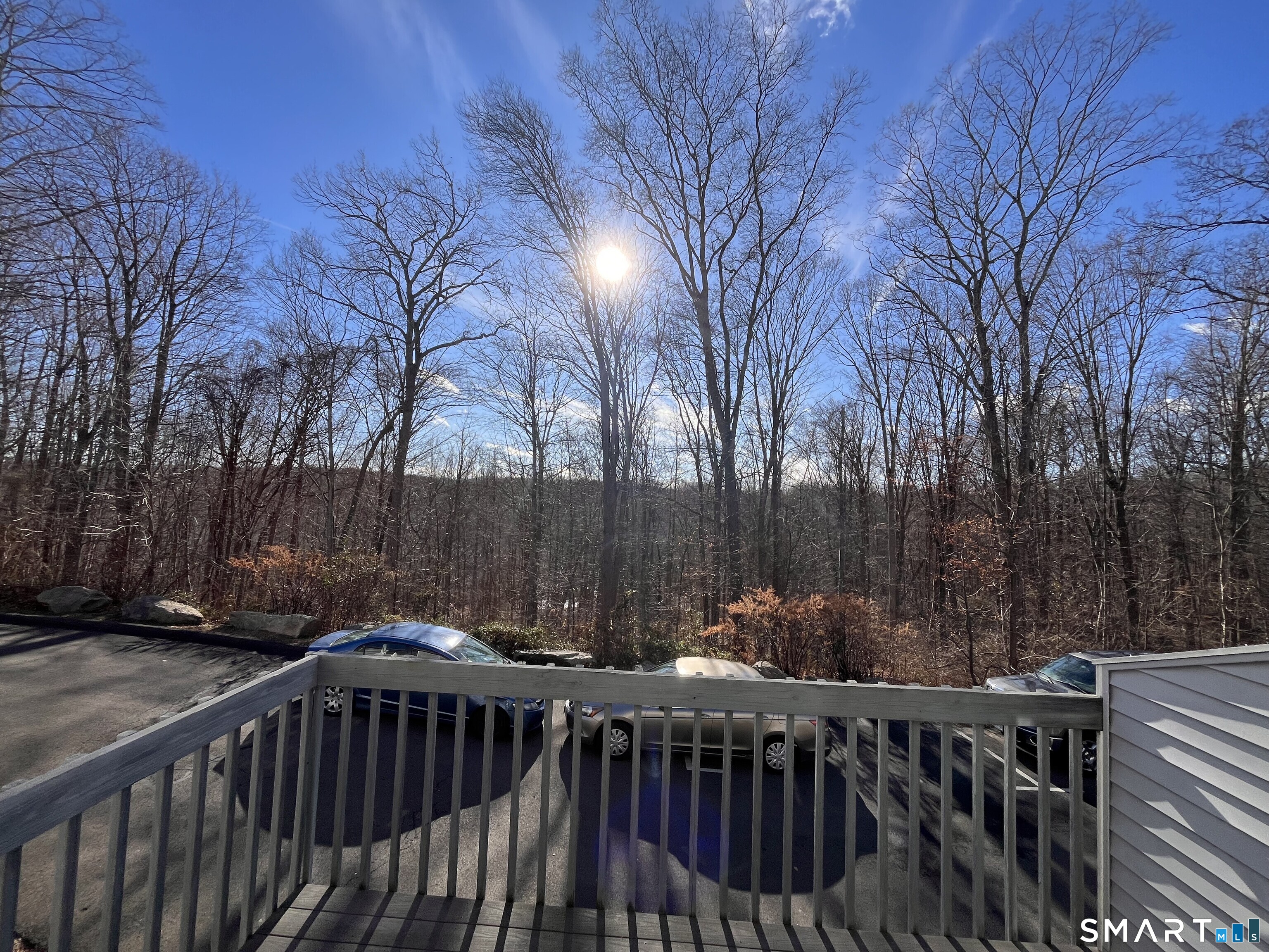 2470 Boston Post Road, Unit 3 Guilford, CT 06437 - Photo 3 of 4 a view of deck with furniture and trees