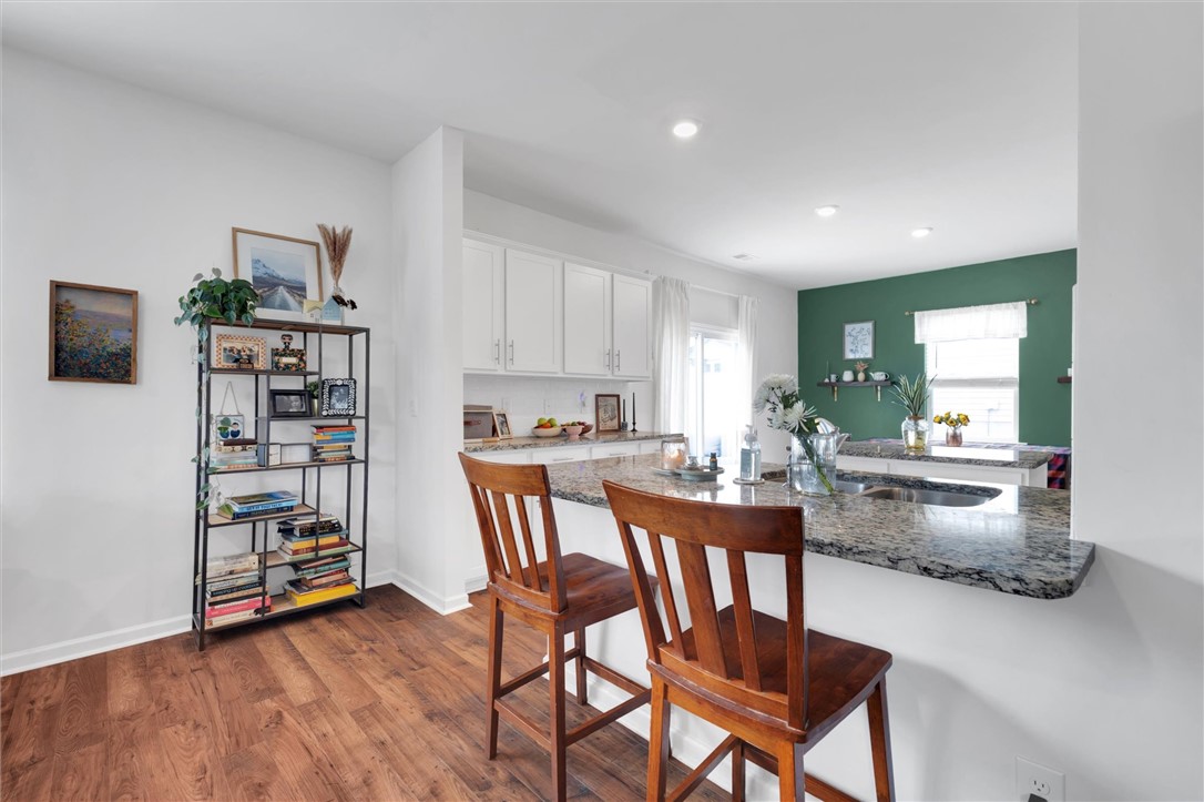 191 Light Spring Road Easley, SC 29642 - Photo 11 of 34 This inviting kitchen boasts a practical island and ample counter space, perfect for culinary endeavors.