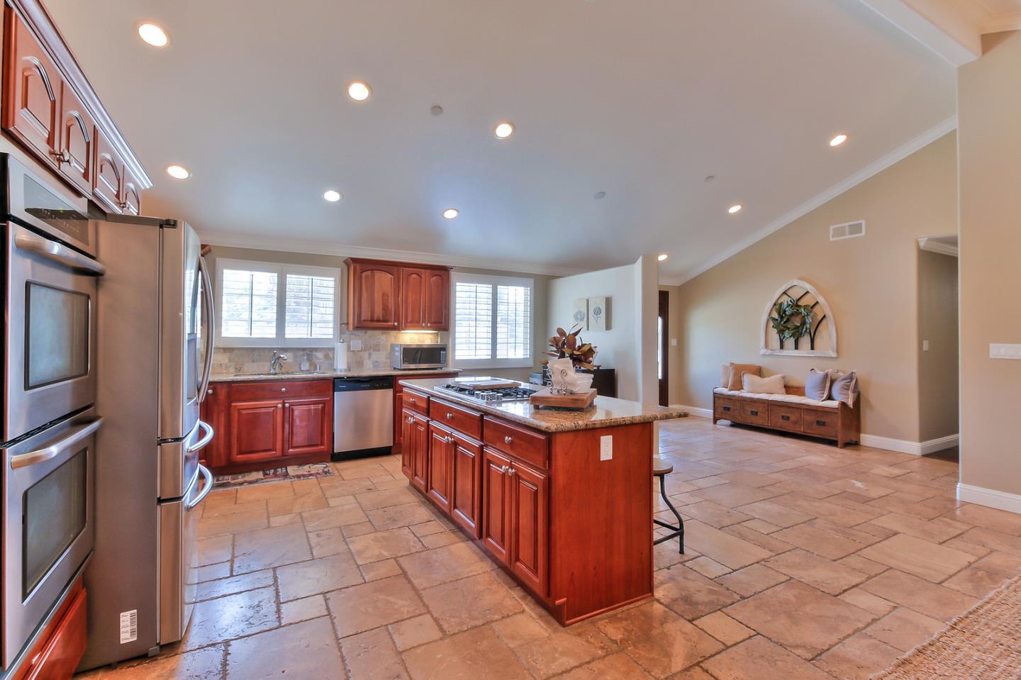 10415 New Avenue Gilroy, CA 95020 - Photo 11 of 55 a kitchen with stainless steel appliances granite countertop a stove and a sink